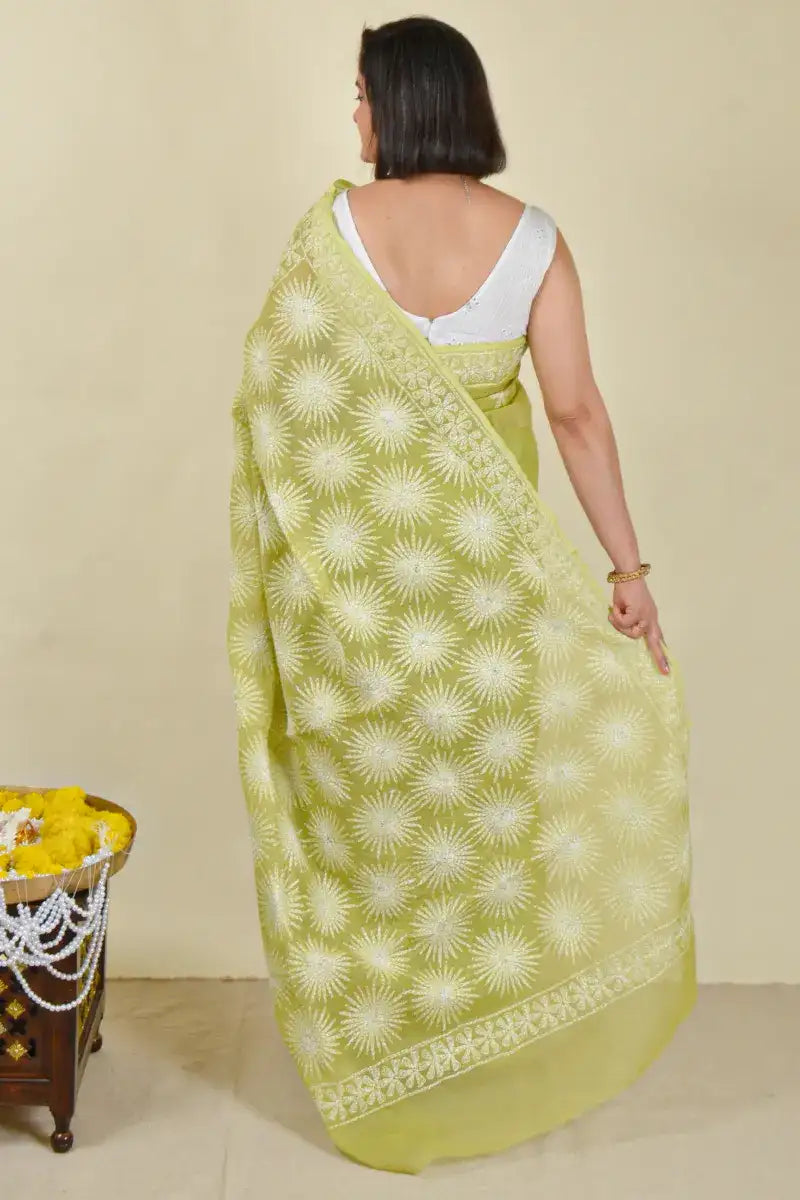 Handcrafted Green Kota Cotton Saree with intricate Lucknowi Chikankari embroidery and a matching blouse, ideal for festive and wedding occasions.