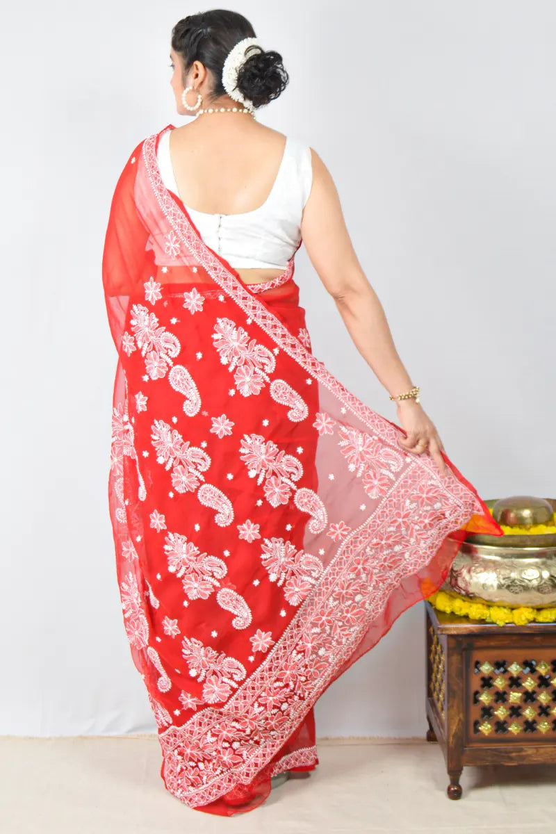 Red georgette saree with intricate Lucknowi Chikankari embroidery and matching blouse – handcrafted festive wear by MeMaana.
