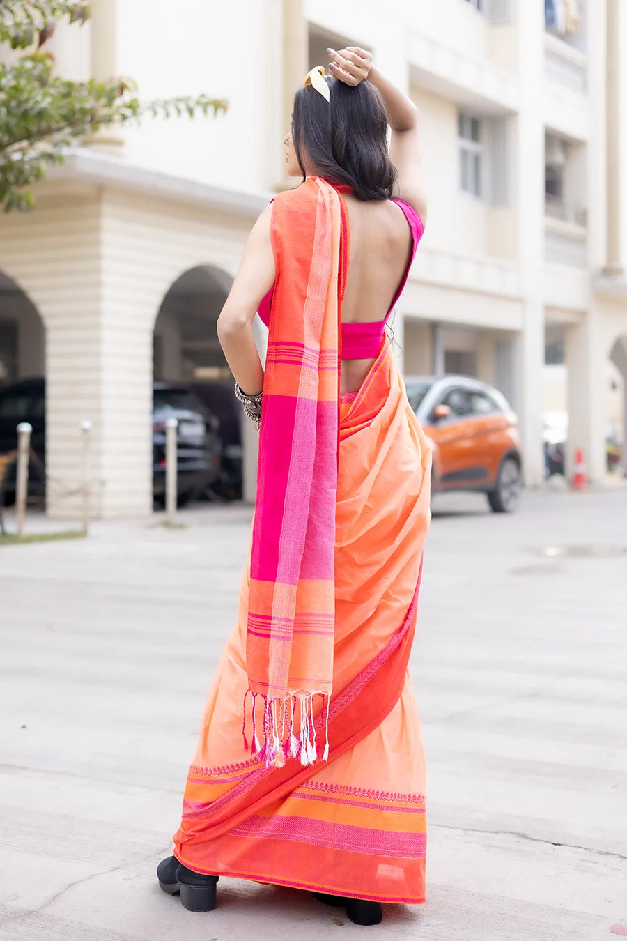 Chanchala - Peach Orange Saree with Pink Border MeMaana