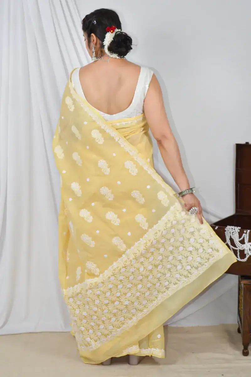 Handcrafted Yellow Designer Cotton saree with intricate Lucknowi Chikankari embroidery and a matching blouse, ideal for festive and wedding .