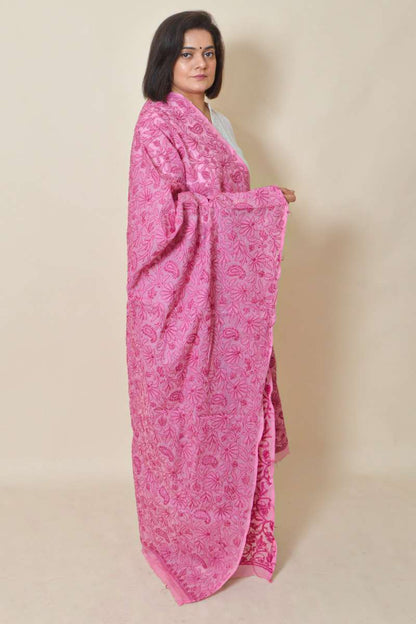 Woman draped in Fabnuma Handcrafted Pink Cotton Allover Chikankari Dupatta with intricate floral embroidery.