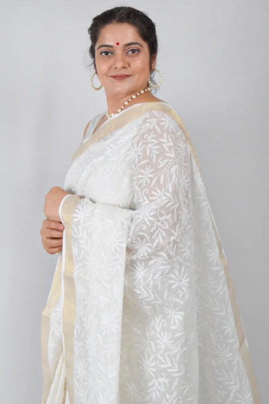 White Kota cotton saree with Lucknowi Chikankari and zari border, paired with matching blouse – handcrafted by MeMaana.