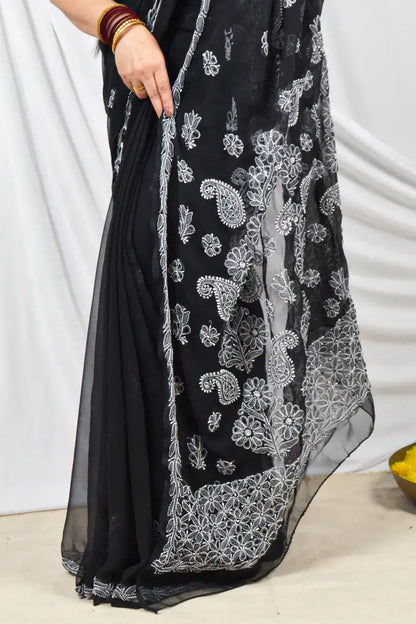 Handcrafted Black Georgette saree intricate Lucknowi Chikankari embroidery and a matching blouse, ideal for festive and wedding occasions.