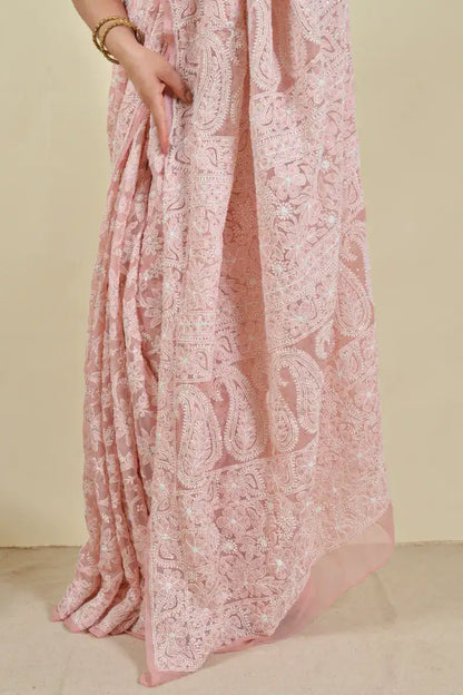 Handcrafted Peach Georgette Saree with intricate Lucknowi Mukaish work Chikankari embroidery and a matching blouse, ideal for festive and wedding occasions.