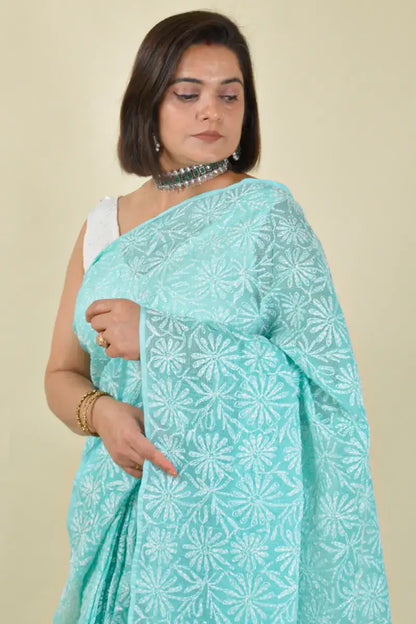 Handcrafted Sea green Kota Cotton saree with intricate Lucknowi Chikankari embroidery and a matching blouse, ideal for festive and wedding occasions.