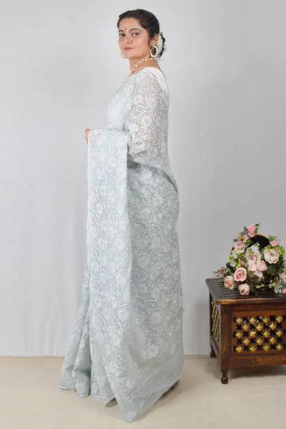 Light gray Kota cotton saree with hand-embroidered Lucknowi Chikankari and matching blouse – breathable and handcrafted ethnic saree by MeMaana.