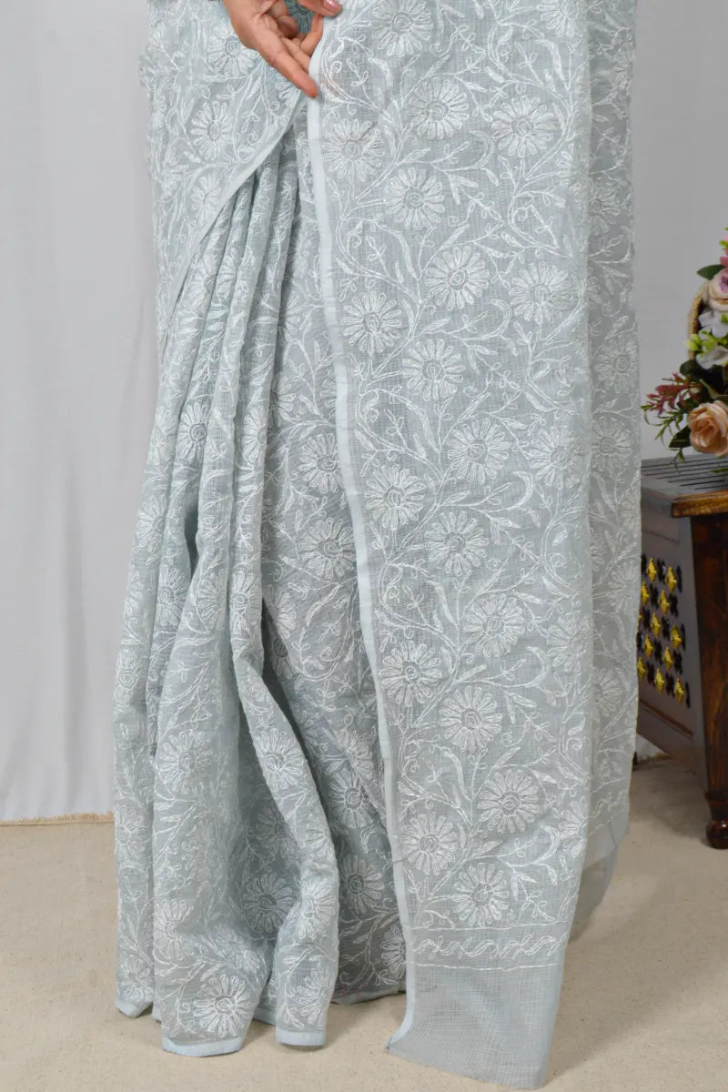 Light gray Kota cotton saree with hand-embroidered Lucknowi Chikankari and matching blouse – breathable and handcrafted ethnic saree by MeMaana.