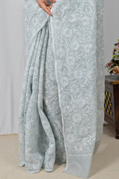 Light gray Kota cotton saree with hand-embroidered Lucknowi Chikankari and matching blouse – breathable and handcrafted ethnic saree by MeMaana.