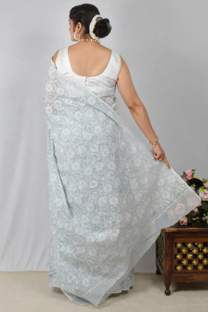 Light gray Kota cotton saree with hand-embroidered Lucknowi Chikankari and matching blouse – breathable and handcrafted ethnic saree by MeMaana.