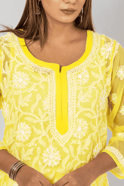 Fabnuma Handcrafted Chikankari Yellow Georgette Short Top with intricate white embroidery and cotton thread detailing.