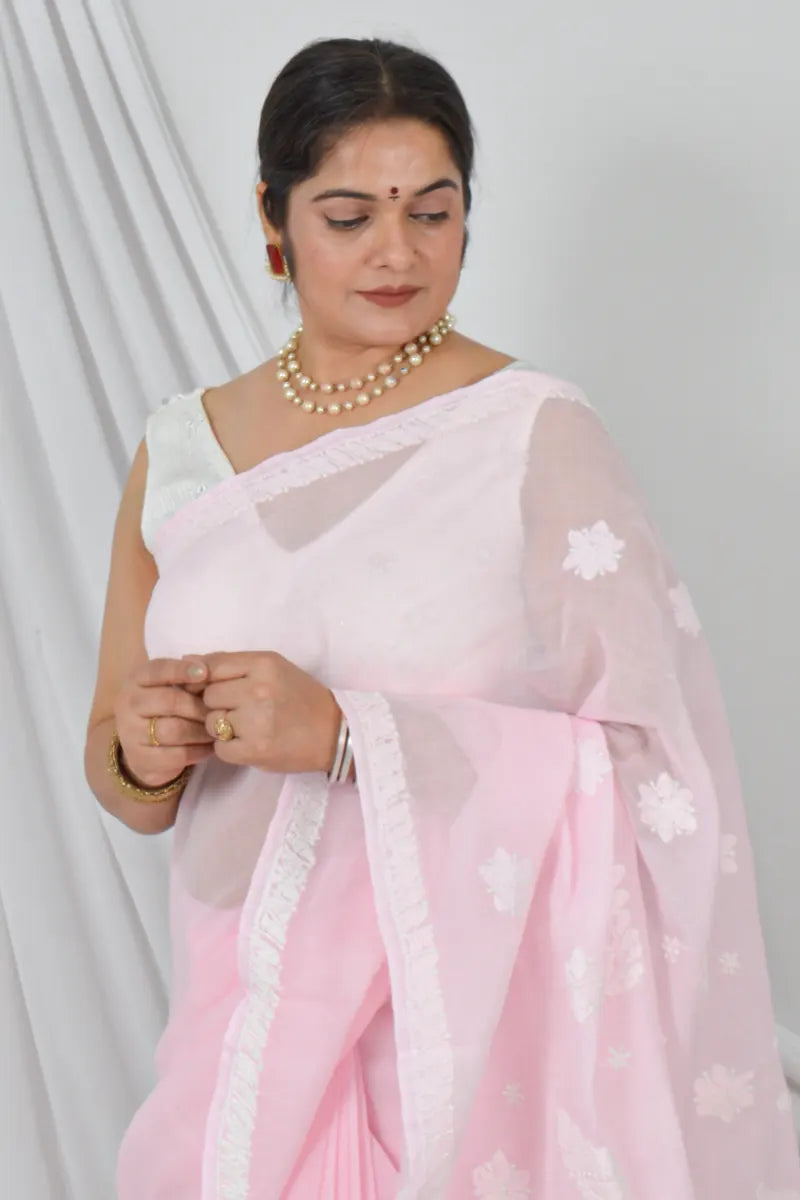 Woman wearing Memaana Handcrafted Pink Cotton Border Palla Chikankari Saree with Blouse in elegant pink shade.