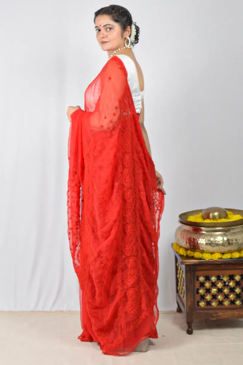 Red georgette saree with hand-embroidered Lucknowi Chikankari and unstitched blouse – festive and elegant ethnic wear by MeMaana.