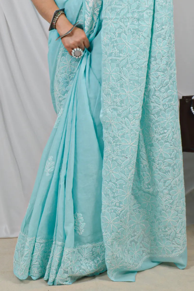 Handcrafted Sky Blue Border Palla Cotton saree with intricate Lucknowi Chikankari embroidery and a matching blouse, ideal for festive and wedding .