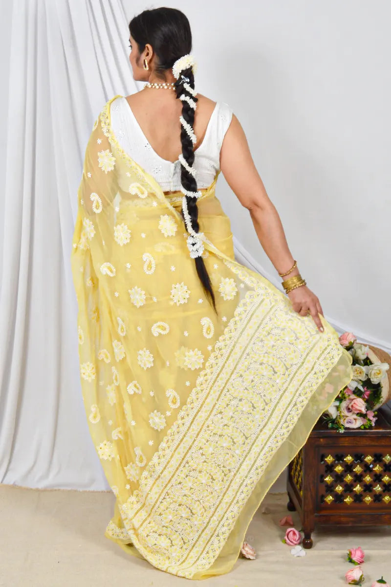 Handcrafted Yellow Georgette Saree with intricate Lucknowi Chikankari Embroidery and a matching Blouse, ideal for Festive and  occasions.