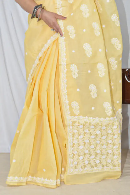 Handcrafted Yellow Designer Cotton saree with intricate Lucknowi Chikankari embroidery and a matching blouse, ideal for festive and wedding .