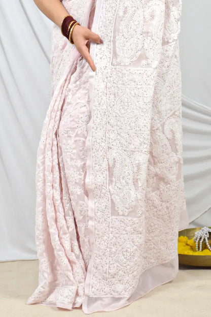 Handcrafted Dust Pink Georgette Saree with intricate Allover Lucknowi Chikankari with Muakish Embroidery and a matching blouse, ideal for festive and wedding occasions.