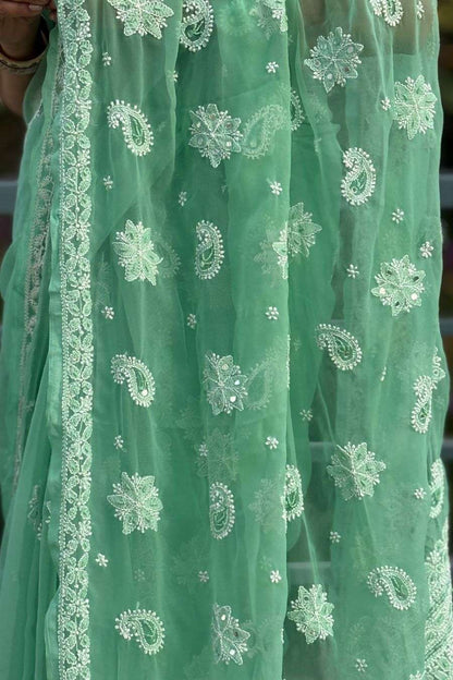 Pallu detail of MeMaana green georgette chikankari saree with fine handcrafted work