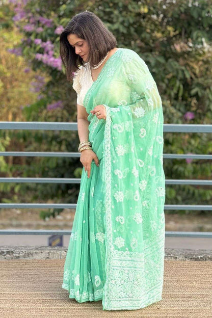 Side view of MeMaana green georgette Lucknowi chikankari saree with elegant drape