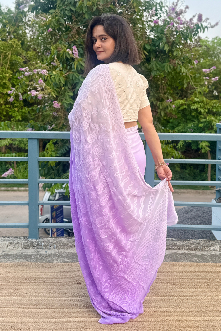 Upper body view of lavender Chikankari saree dupatta showing large paisley motifs and delicate floral hand embroidery