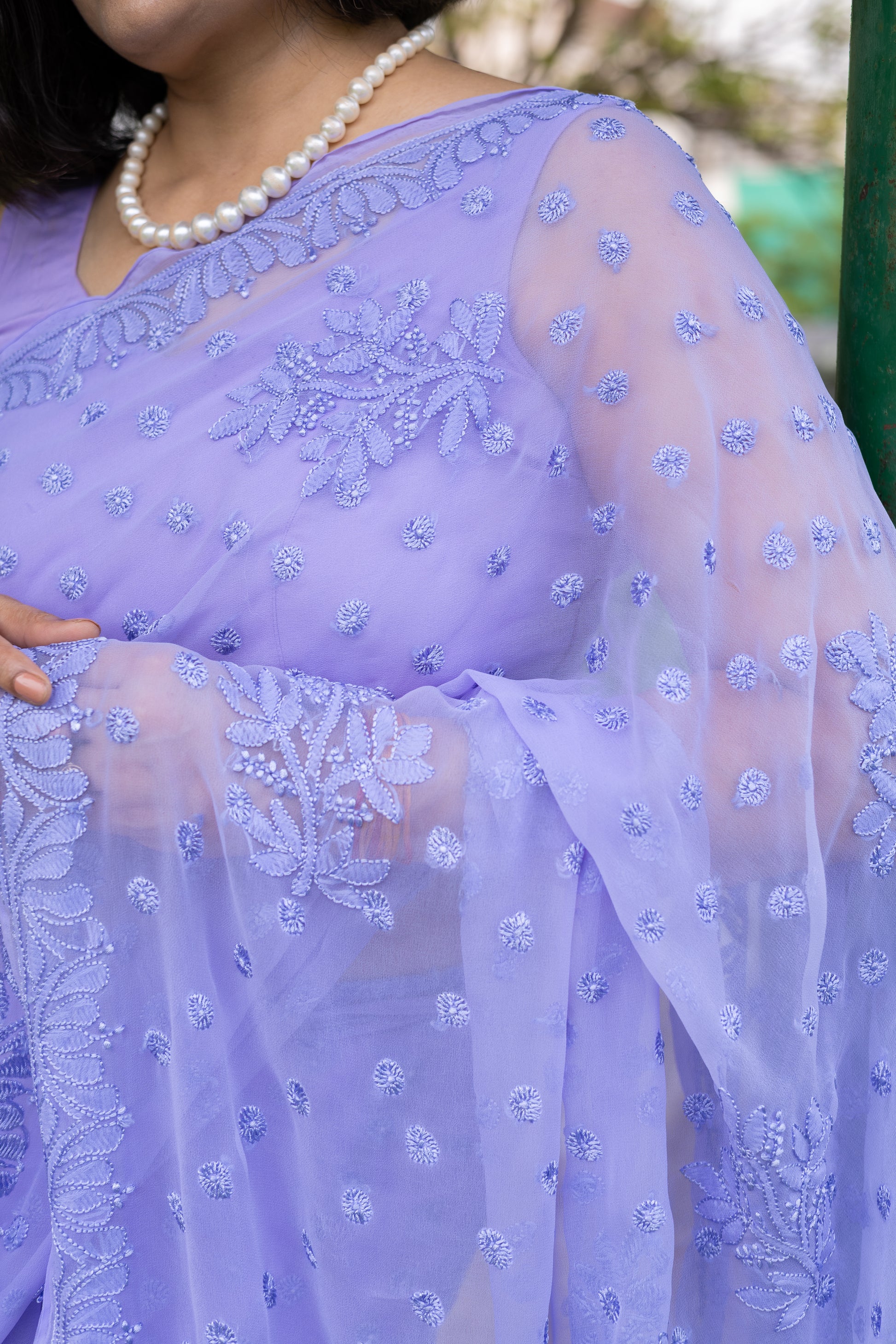 Close-up of lavender georgette Lucknowi chikankari hand embroidery on saree shoulder