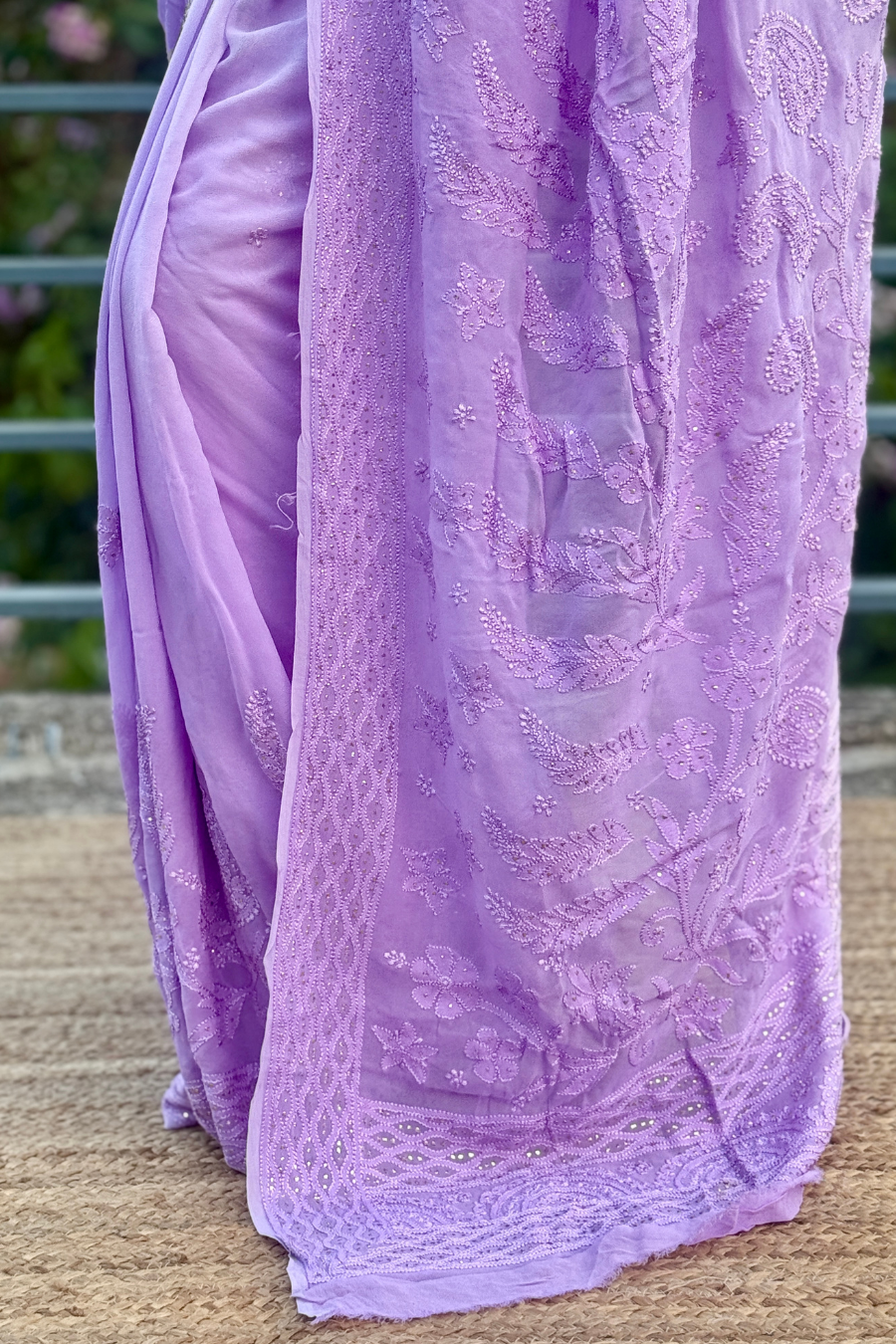 Back view of shaded lavender Chikankari saree showing heavily embroidered pallu with white-on-lavender shadow work