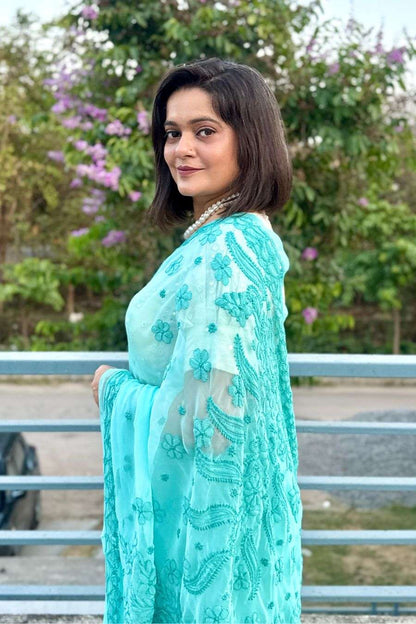 Handcrafted sea green chikankari saree side pose model